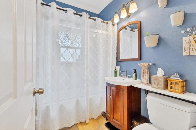 full bathroom featuring vanity, tile patterned flooring, toilet, ornamental molding, and shower / tub combo