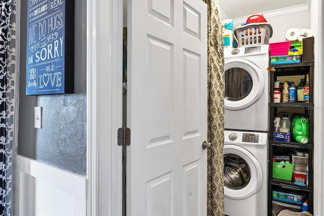 clothes washing area with stacked washer / drying machine