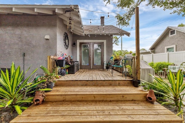 doorway to property with french doors and a deck