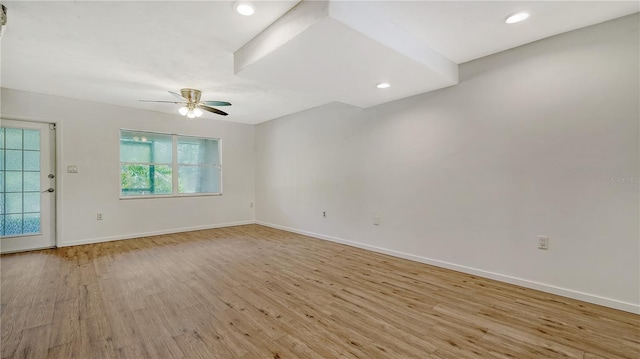 spare room with ceiling fan and light hardwood / wood-style floors