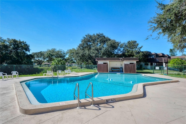 view of swimming pool featuring a patio