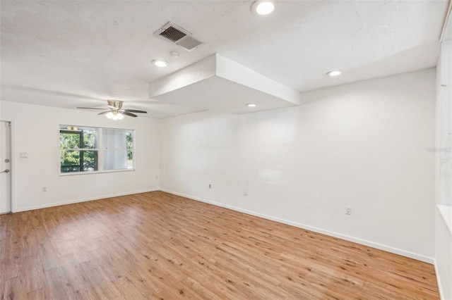 spare room with ceiling fan and light hardwood / wood-style flooring