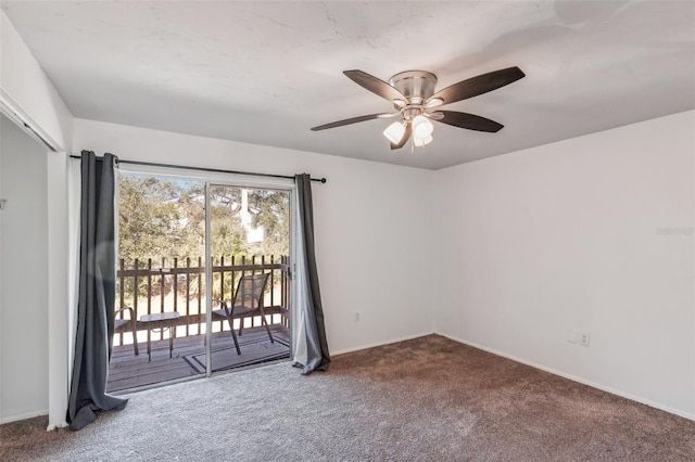 empty room featuring carpet flooring and ceiling fan