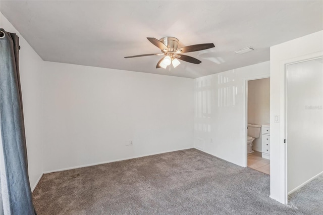 empty room with light colored carpet and ceiling fan