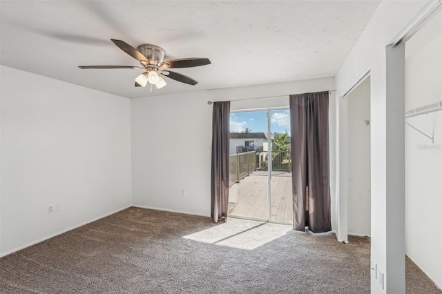 carpeted empty room with ceiling fan