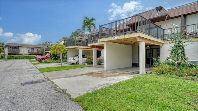 exterior space featuring a carport