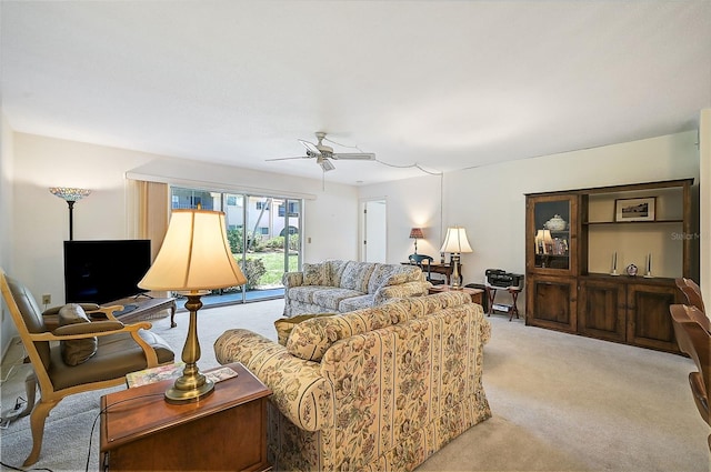 living room with ceiling fan and light carpet