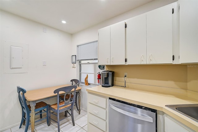 kitchen featuring white cabinets, dishwasher, light tile patterned floors, and electric panel