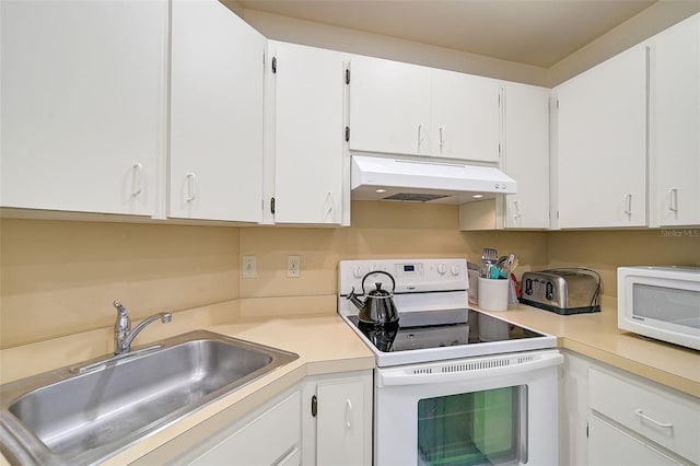 kitchen with white cabinets, white appliances, and sink