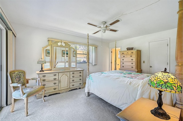 bedroom with ceiling fan and light colored carpet