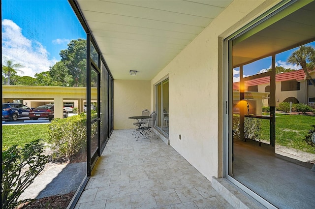 unfurnished sunroom featuring plenty of natural light