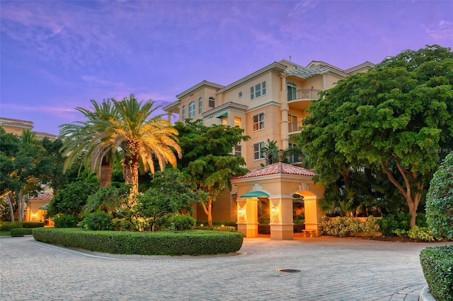 mediterranean / spanish home with a balcony