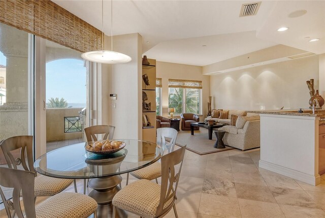 dining area featuring light tile patterned flooring