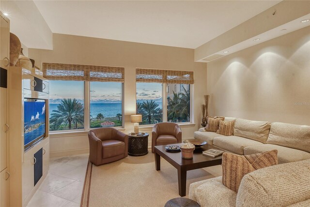 tiled living room featuring a healthy amount of sunlight