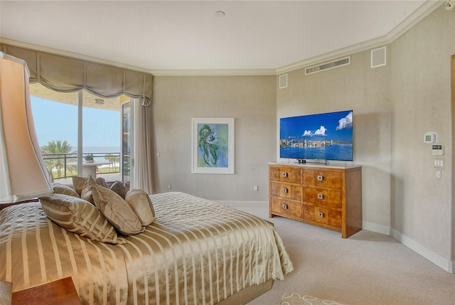 carpeted bedroom with access to exterior and crown molding