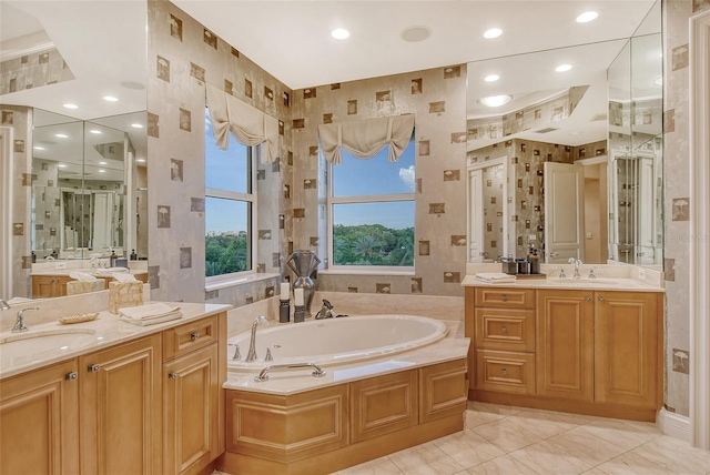 bathroom with tile patterned floors, vanity, and independent shower and bath