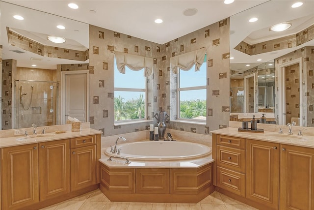 bathroom featuring double vanity, separate shower and tub, and tile patterned flooring