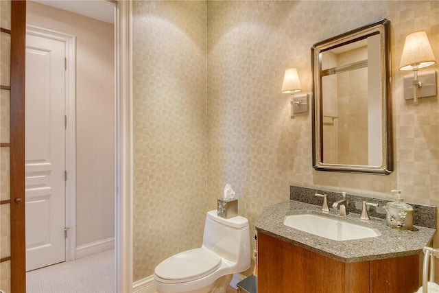 bathroom featuring tile patterned floors, vanity, and toilet