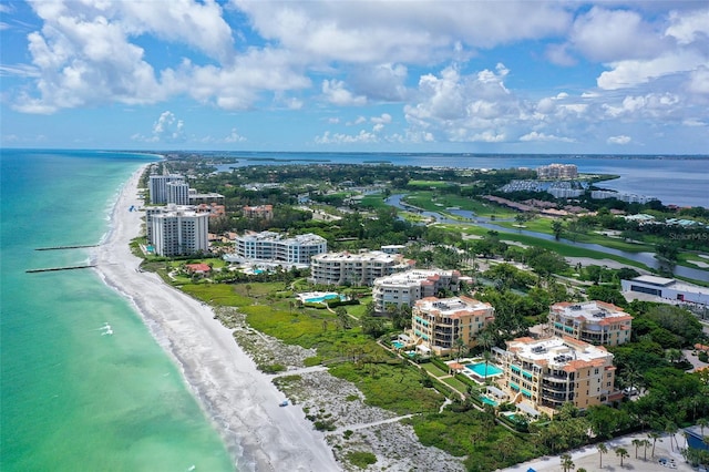 bird's eye view with a water view and a view of the beach