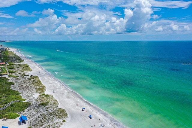 birds eye view of property featuring a water view and a view of the beach