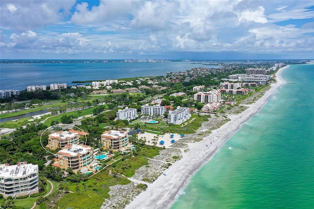 birds eye view of property featuring a view of the beach and a water view