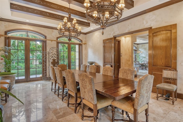 dining room with french doors, ornamental molding, a chandelier, and a high ceiling