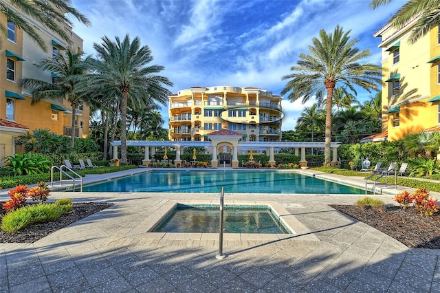 view of pool with a community hot tub