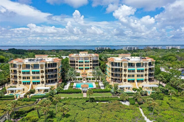 birds eye view of property with a water view