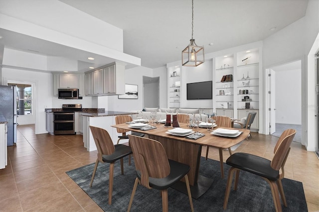 dining area featuring light tile patterned flooring, recessed lighting, and built in shelves