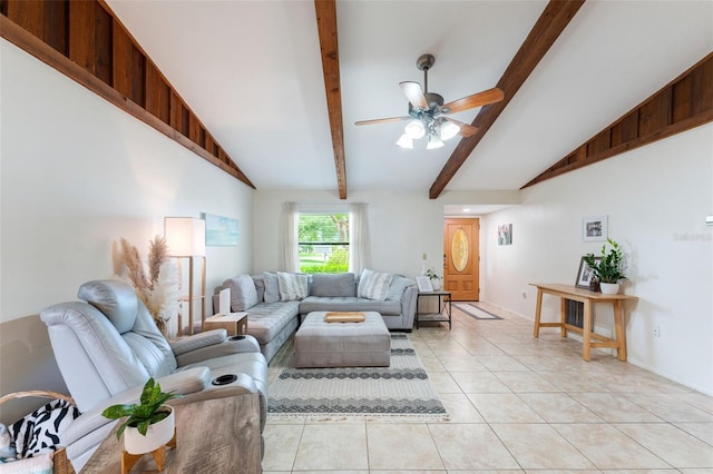 living room with vaulted ceiling with beams, ceiling fan, and light tile patterned floors