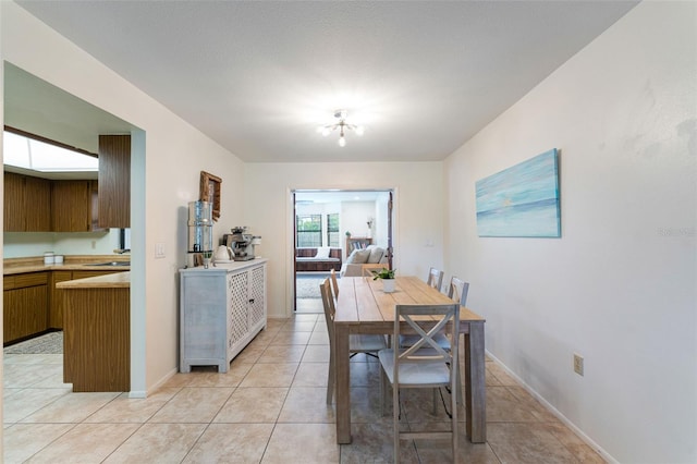 dining area with light tile patterned flooring