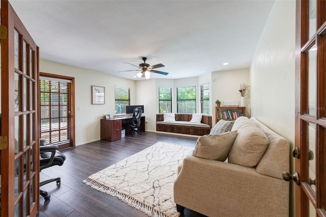 living room featuring french doors, ceiling fan, plenty of natural light, and dark hardwood / wood-style floors