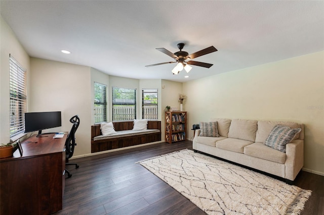 home office featuring dark hardwood / wood-style flooring and ceiling fan