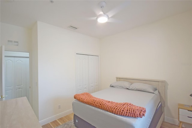 bedroom with ceiling fan and light hardwood / wood-style flooring