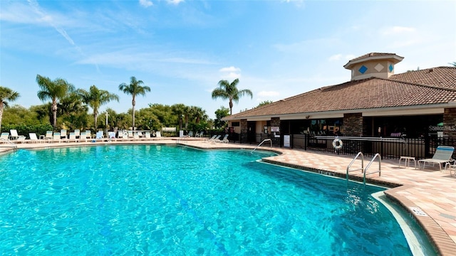 view of swimming pool with a patio area