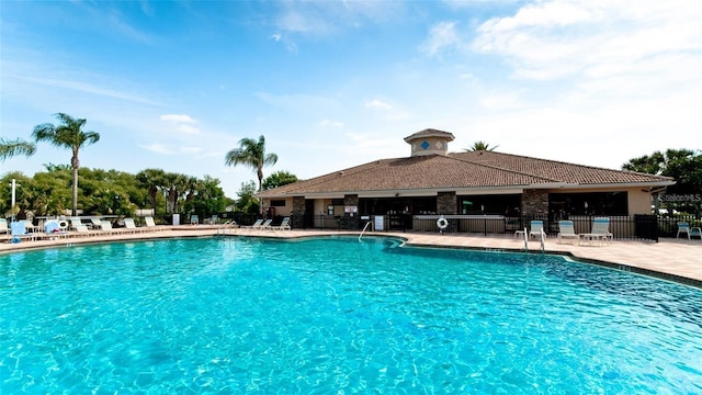 view of swimming pool with a patio