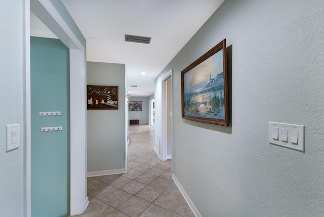 hallway with light tile patterned flooring