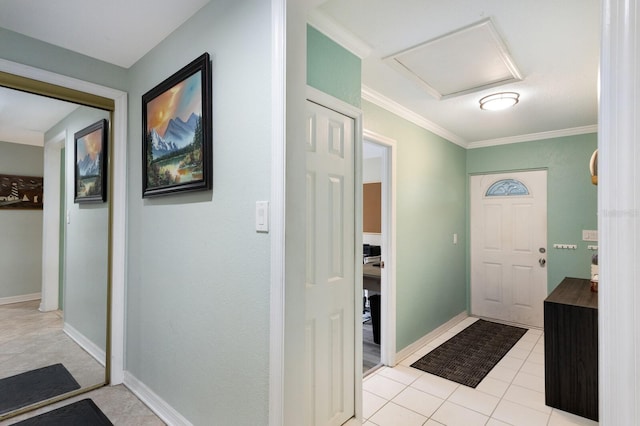 tiled entrance foyer with crown molding