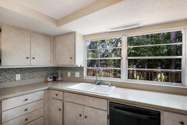 kitchen featuring backsplash, sink, a textured ceiling, and black dishwasher