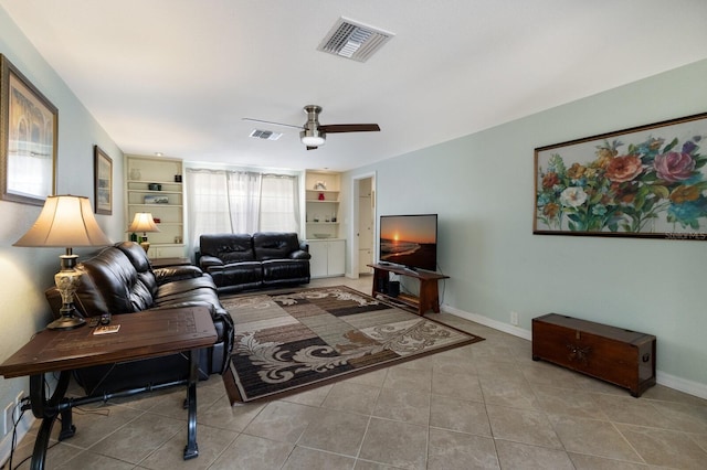 living room with ceiling fan, light tile patterned flooring, and built in features