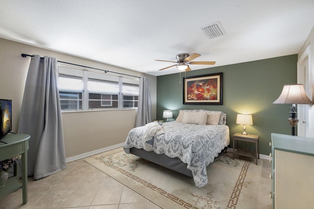 bedroom featuring ceiling fan and light tile patterned flooring