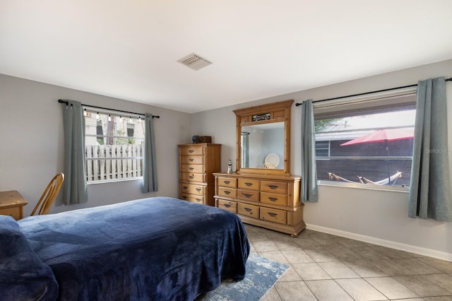 bedroom featuring light tile patterned floors