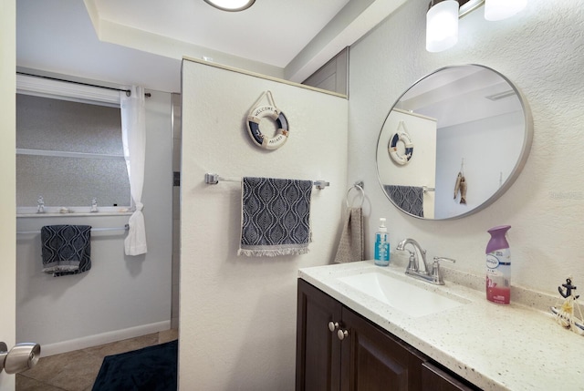 bathroom featuring tile patterned floors and vanity