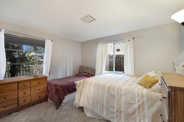 bedroom featuring light tile patterned flooring