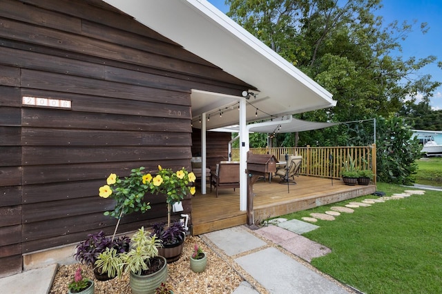 wooden deck with a yard