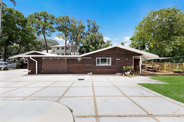 view of side of property featuring a patio