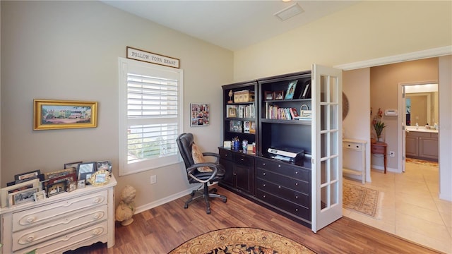 office space featuring light tile floors