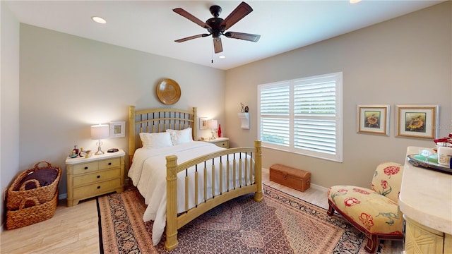 bedroom featuring light hardwood / wood-style floors and ceiling fan