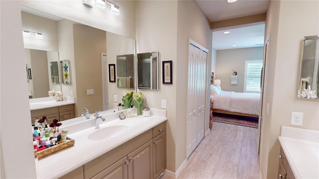 bathroom featuring vanity and hardwood / wood-style floors