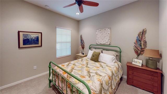 bedroom with ceiling fan and carpet floors